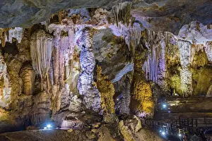 Stalagmite And Stalactite Caves Drucke: Illuminated cave, steps and stalactites