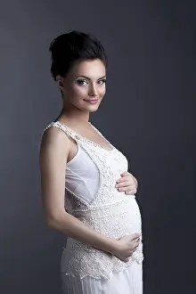 Expectant Mother Drucke: Image of charming expectant mother posing looking at camera