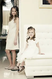 Friends Celebrating Together Drucke: Image of elegant sisters posing looking at camera