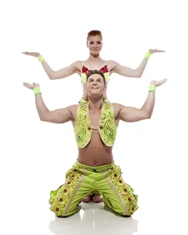Young Couple Acrobatics Drucke: Image of emotional acrobats performing in studio