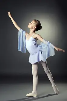 Elegant Pose Drucke: Image of graceful little dancer posing on gray backdrop