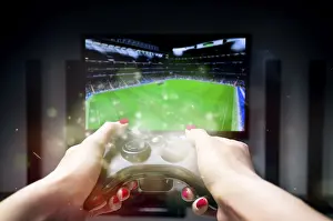 Caucasian Ethnicity Female Drucke: The image of the joystick on the background of the TV screen