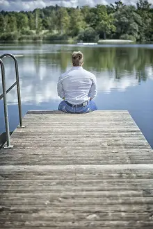 Nature Photography Drucke: An image of a man at the lake