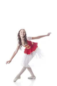 Young Female Dancer Drucke: Image of merry ballerina looking at camera while dancing