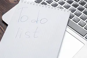 Office Work Inspiration Drucke: Image of a notebook with a pen lying on a laptop