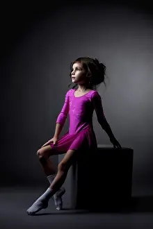 Fitness Studio Shot Drucke: Image of pretty rhythmic gymnast sitting on cube in studio