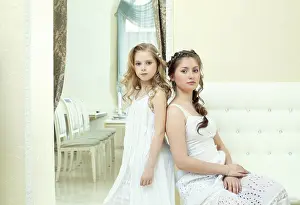 Decorative Studio Shots Drucke: Image of pretty smart sisters posing at camera
