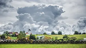 Gloomy Weather Germany Drucke: An image of a storm cloud over Frieding Bavaria Germany