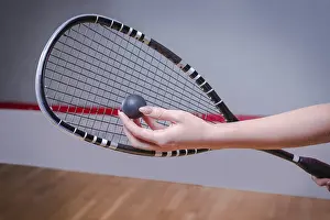 Championship Victory Drucke: Image of a woman's hand with a squash racket