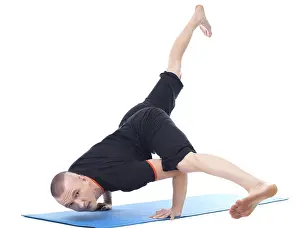 Gymnastics Training Photos Drucke: Image of yogi posing in studio looking at camera