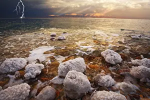 Uninhabited Beach Scene Drucke: Improbable spring thunder-storm above the sea