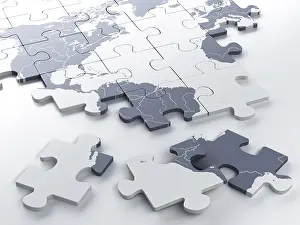 Studio Shot Of A Map Drucke: Incomplete puzzle with a world map