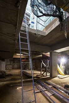 Construction Progress Drucke: An indoor construction site with essential elements like ladders