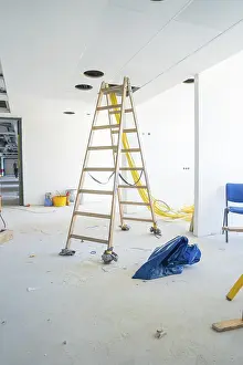 Residential Building Modification Drucke: Interior under construction with ladder