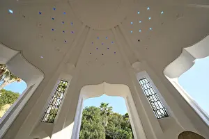 Geothermal Power Source Greece Drucke: Interior of a white dome with transparent patterns and a large window opening that lets light into the interior