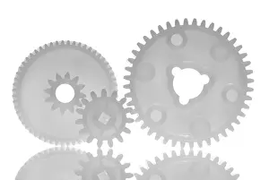Medical Teamwork Drucke: Three interlinked gear wheels