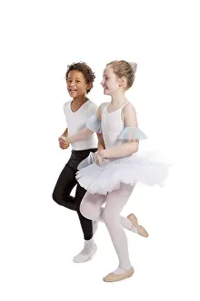 White Background Studio Photo Drucke: Interracial children dancing together