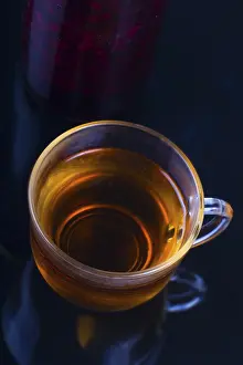 Empty Tableware Setup Drucke: Jam and a Cup of tea on a dark background