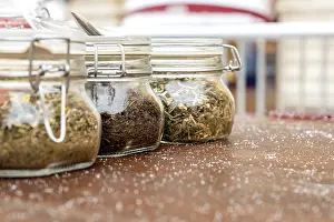 Alternative Medicine Tea Drucke: Jars with three different types of tea are on the table