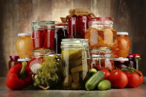 Homemade Preserves Drucke: Jars with pickled vegetables and fruity compotes