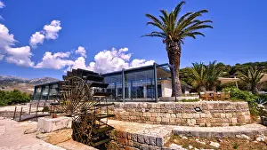 Hydroelectric Power Plant Drucke: Katavothres, modern building, palm tree