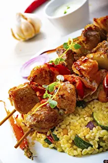 Grilled Lamb Dish Drucke: Kebabs with vegetables and bulgur