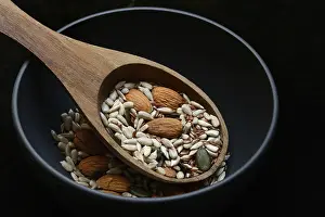 Pumpkin Seed Benefits Drucke: Kernels in ladle, kernel mix of almond kernels