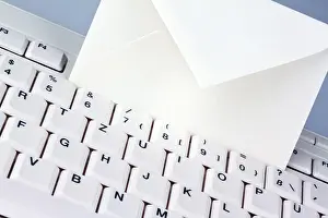 Austria Office Supplies Drucke: The keyboard of a computer and an envelope
