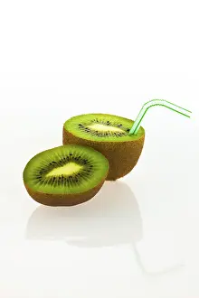 Fruity Studio Shot Drucke: Kiwi fruit with a drinking straw as a soft drink