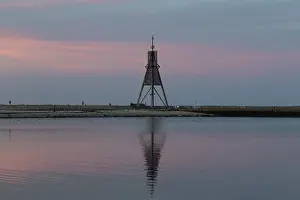 North Sea Coast Landscape Drucke: Kugelbake with water reflection in the sunset
