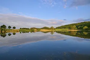 Evening Light Architecture Drucke: Lake with reflection in spring with castle at sunset