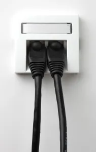 Electrical Wire Drucke: LAN cable, network cable in a socket