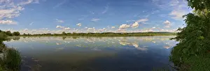 Cloudy European Landscapes Drucke: Landscape of Danubia river with reflection of the landscape and Clouds