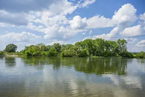 Bavaria Germany Photography Drucke: Landscape of Danubia river with reflection of the landscape and Clouds