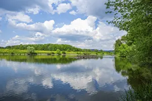 Danube River Landscape Drucke: Landscape of Danubia river with reflection of the landscape and Clouds
