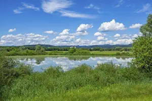 Danube River Landscape Drucke: Landscape of Danubia river with reflection of the landscape and Clouds