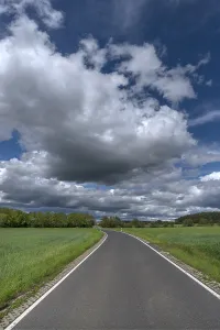 Southern Germany Countryside View Drucke: Landscape with road and cloudy sky