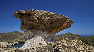 Greek Island Landscapes Drucke: Large bizarre rock formation against a clear blue sky