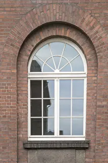 Deserted Construction Sites Drucke: Large mullioned window on a 100-year-old building