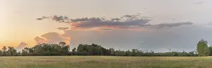 Evening Sun In France Drucke: Large pink cloud at sunset over meadow in spring