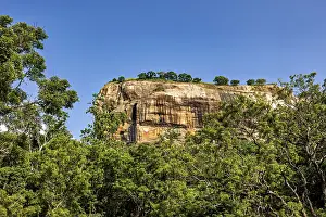 Green Forest Landscape Photography Drucke: A large rock rises above a thick