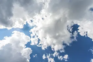 Empty Skies Photography Drucke: Large white clouds against a blue sky