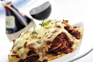 High Calorie Nutrition Facts Drucke: Lasagna, red wine in background
