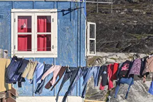 Laundry drying in the wind in front of the house