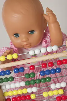 Educational Institution Image Drucke: Learning arithmetics, doll using an abacus