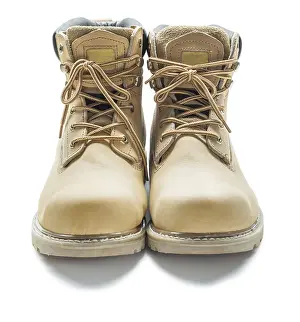 White Background Detail Drucke: Leather work boots against a white background