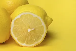 Healthy Fruit Options Drucke: Lemon slice against yellow background, lemon