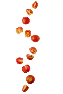 Raw Nutrition Food Drucke: Levitating tomato cherry isolated on white background
