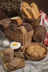 Breakfast Meal Setup Drucke: Still life with different kinds of bread on a tablecloth