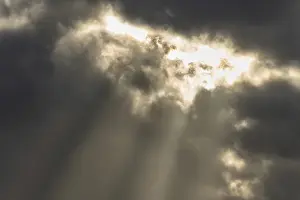 Cloudy Sky Europe Drucke: Light rays of the sun's rays through clouds in the morning